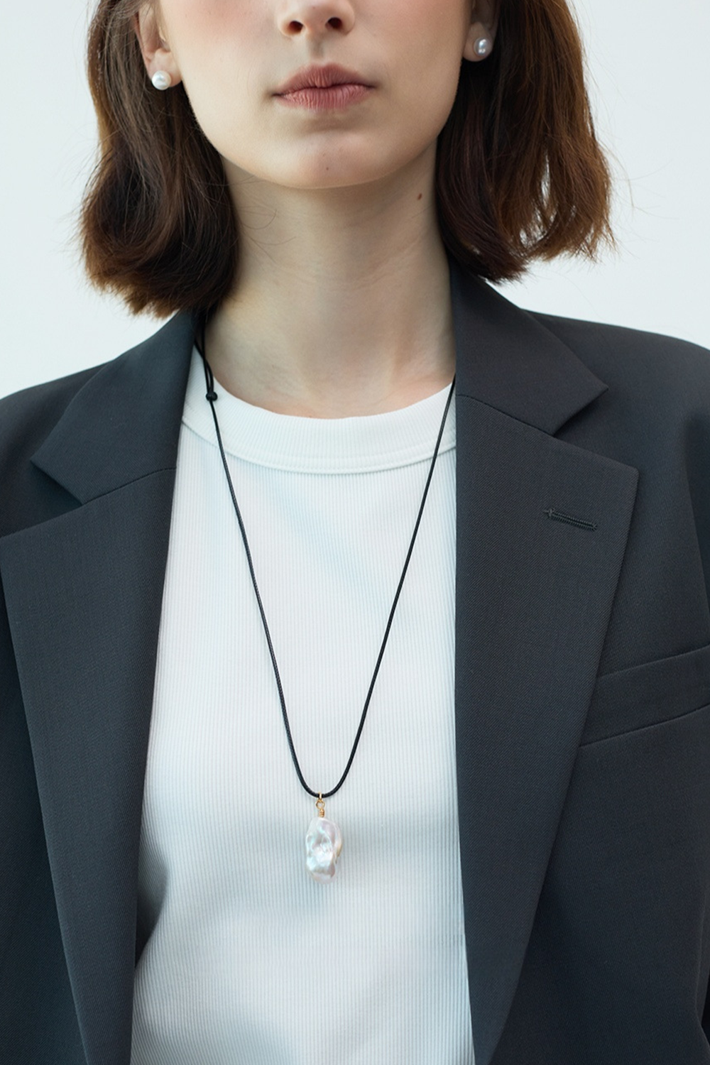 Milky Baroque Pearl Drop Radiating Against Grey Wool Blazer | Seysage