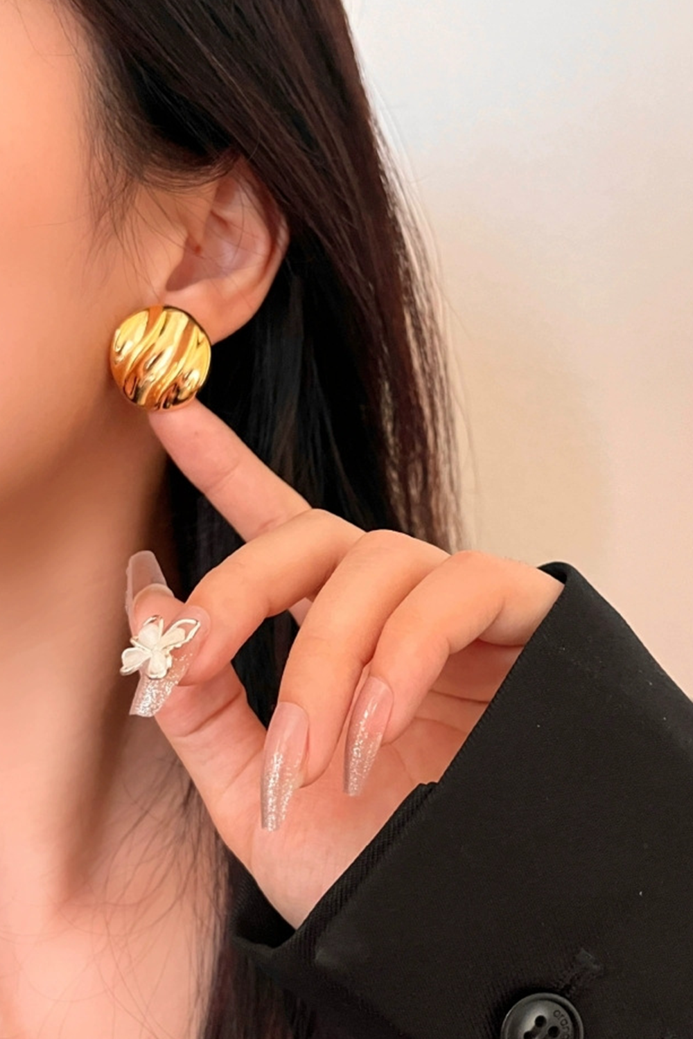 Gold Hammered-Texture Stud Glinting Under Fingertip Glow | Seysage