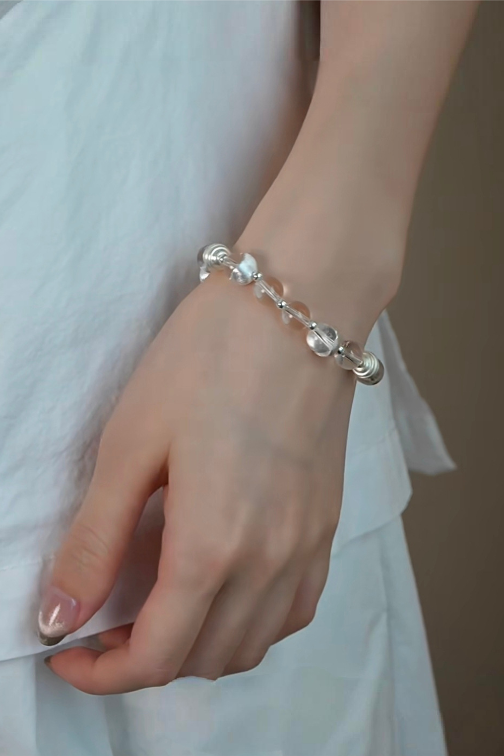 Asymmetrical Lunar Fragment Bracelet Adorning Nude-Manicured Skin over White Slub Cotton | Seysage