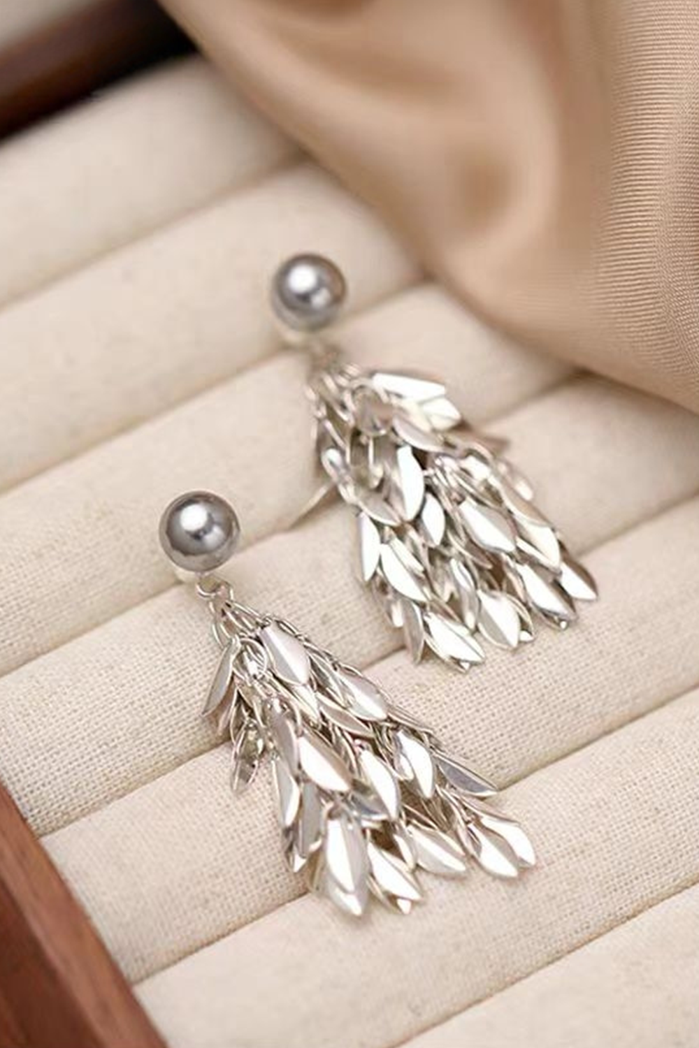 Silver tassel earrings on striped linen - Organic texture with silk accent