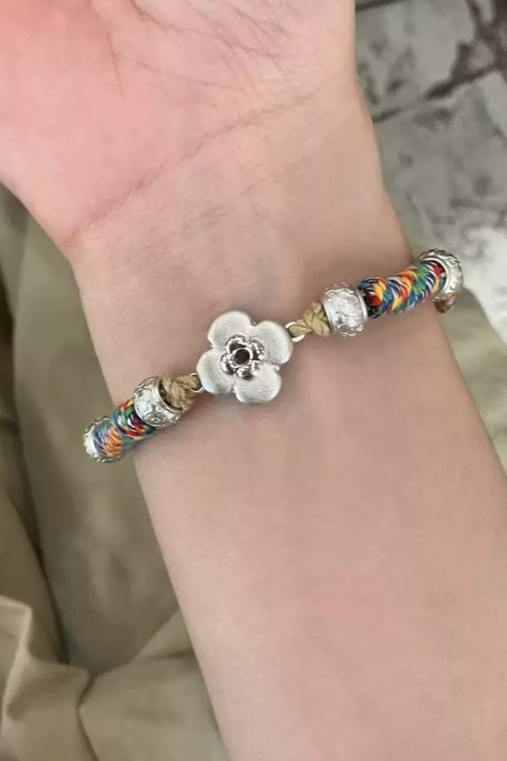 Vibrant Woven Strand Adorning Fair Wrist Featuring Silver Clover Bloom | Seysage